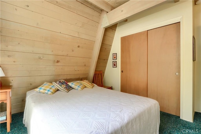 60027 Cascadel Dr S, North Fork, CA 93643 - bedroom with dark colored carpet, wooden walls, and a closet