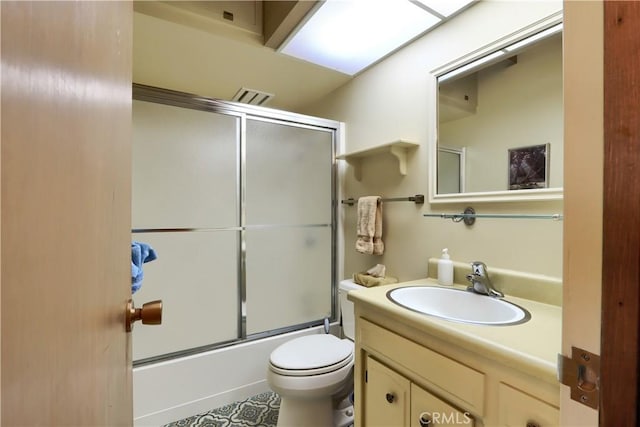 60027 Cascadel Dr S, North Fork, CA 93643 - bathroom featuring vanity, toilet, and enclosed tub / shower combo