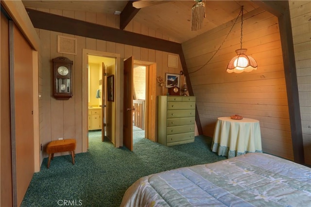 60027 Cascadel Dr S, North Fork, CA 93643 - bedroom featuring carpet flooring, wooden walls, and ensuite bathroom