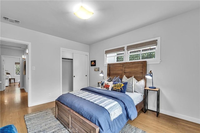 21820 Dumetz Rd, Woodland Hills, CA 91364 - bedroom with wood finished floors and a closet