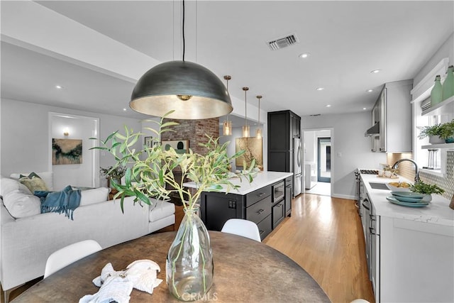 21820 Dumetz Rd, Woodland Hills, CA 91364 - dining space featuring light wood-style flooring and recessed lighting