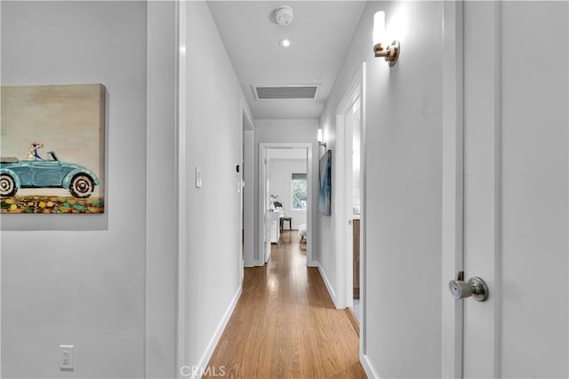 21820 Dumetz Rd, Woodland Hills, CA 91364 - hallway featuring light wood-style floors and baseboards