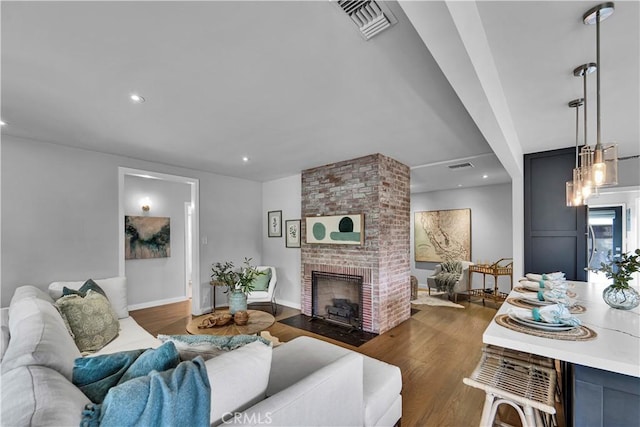 21820 Dumetz Rd, Woodland Hills, CA 91364 - living room featuring dark wood-style floors, a fireplace, and recessed lighting