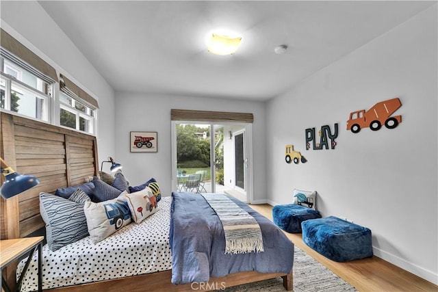 21820 Dumetz Rd, Woodland Hills, CA 91364 - bedroom featuring access to outside and wood finished floors