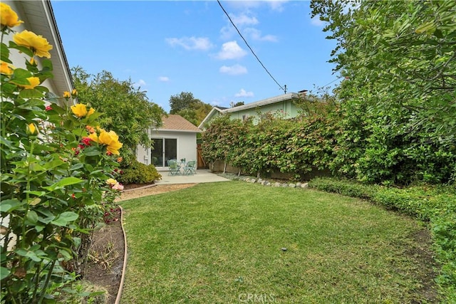 21820 Dumetz Rd, Woodland Hills, CA 91364 - view of green lawn with a patio area
