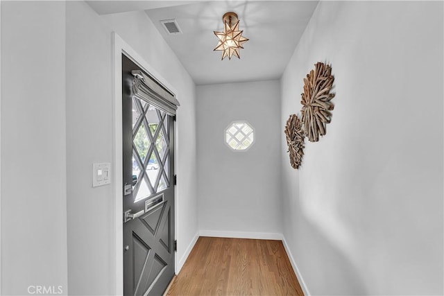 21820 Dumetz Rd, Woodland Hills, CA 91364 - doorway to outside with baseboards and wood finished floors