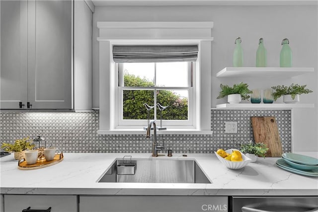 21820 Dumetz Rd, Woodland Hills, CA 91364 - kitchen featuring open shelves, decorative backsplash, light stone countertops, gray cabinets, and stainless steel dishwasher