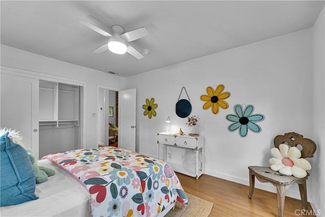 21820 Dumetz Rd, Woodland Hills, CA 91364 - bedroom with wood finished floors, a closet, baseboards, and a ceiling fan