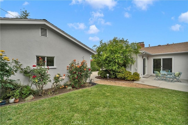 21820 Dumetz Rd, Woodland Hills, CA 91364 - view of grassy yard featuring a patio area