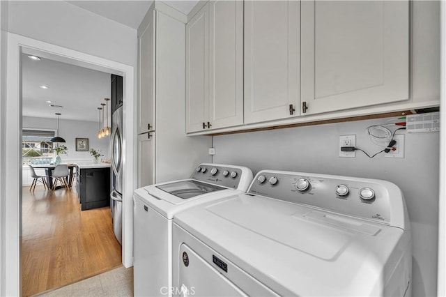 21820 Dumetz Rd, Woodland Hills, CA 91364 - laundry room with cabinet space, separate washer and dryer, and recessed lighting