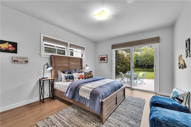 21820 Dumetz Rd, Woodland Hills, CA 91364 - bedroom featuring access to outside and wood finished floors