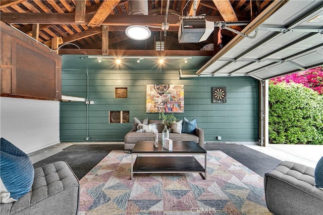 21820 Dumetz Rd, Woodland Hills, CA 91364 - garage featuring a garage door opener and wooden walls
