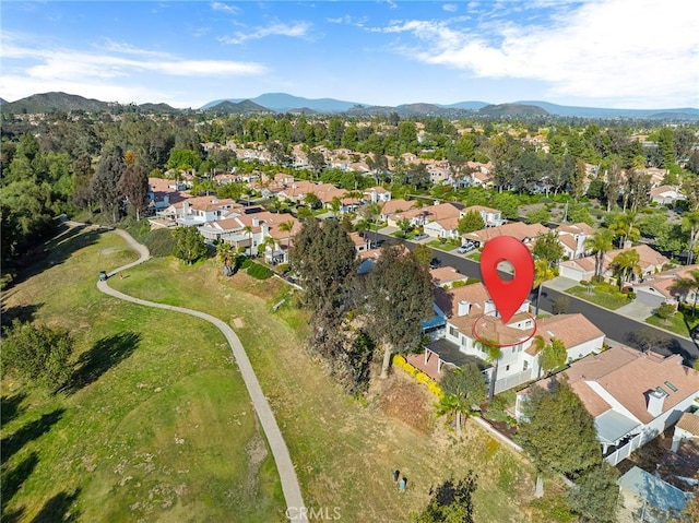 aerial view featuring a mountain view and a residential view