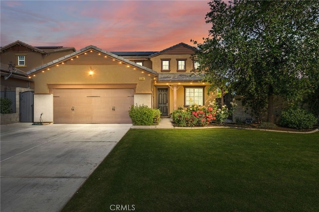 12200 White Rapids Way, Bakersfield, CA 93311 - traditional home with stucco siding, a garage, driveway, a front yard, and roof mounted solar panels