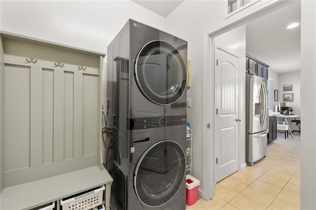 12200 White Rapids Way, Bakersfield, CA 93311 - laundry area with stacked washer / dryer and light tile patterned floors