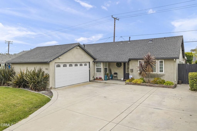 single story home featuring fence, an attached garage, driveway, stucco siding, and a shingled roof