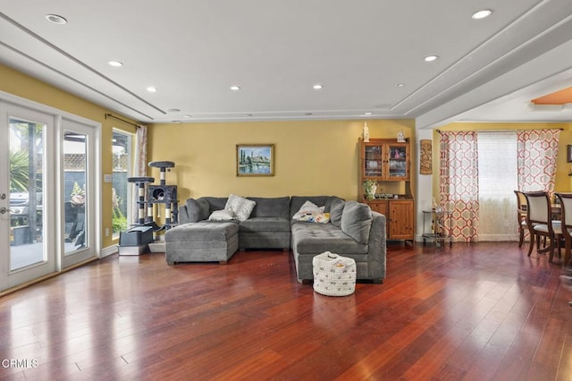 living area featuring a wealth of natural light, recessed lighting, and hardwood / wood-style flooring