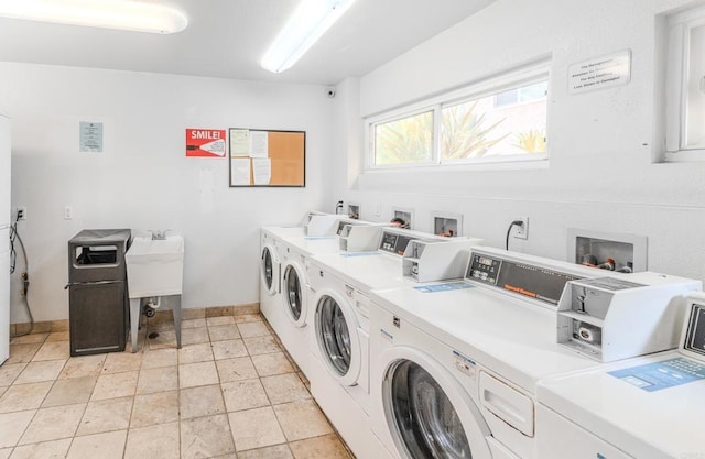 9860 Dale Ave Unit D10, Spring Valley, CA 91977 - communal laundry room featuring washer and clothes dryer and baseboards