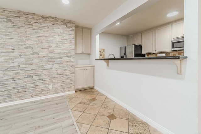 9860 Dale Ave Unit D10, Spring Valley, CA 91977 - kitchen featuring stainless steel appliances, a breakfast bar, dark countertops, and recessed lighting