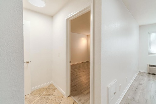 9860 Dale Ave Unit D10, Spring Valley, CA 91977 - hallway with a wall unit AC and baseboards