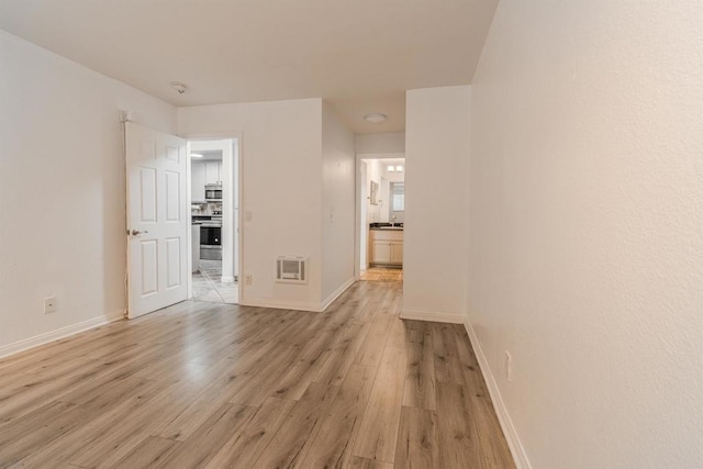 9860 Dale Ave Unit D10, Spring Valley, CA 91977 - spare room with light wood-style flooring and baseboards