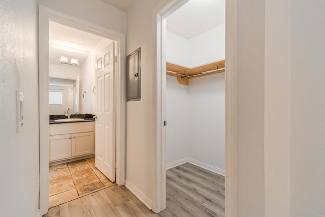 9860 Dale Ave Unit D10, Spring Valley, CA 91977 - hall with light wood-style floors and a sink