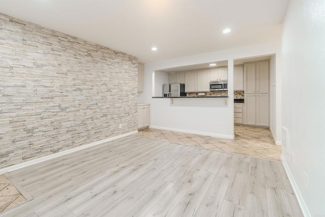 9860 Dale Ave Unit D10, Spring Valley, CA 91977 - unfurnished living room featuring light wood-style flooring and recessed lighting