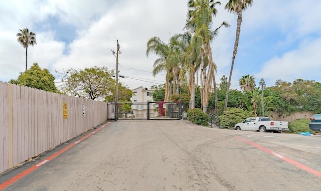 9860 Dale Ave Unit D10, Spring Valley, CA 91977 - view of asphalt road featuring a gate and a gated entry