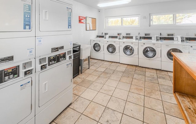 9860 Dale Ave Unit D10, Spring Valley, CA 91977 - communal laundry room with washer and dryer, estacked washer and dryer, and plenty of natural light