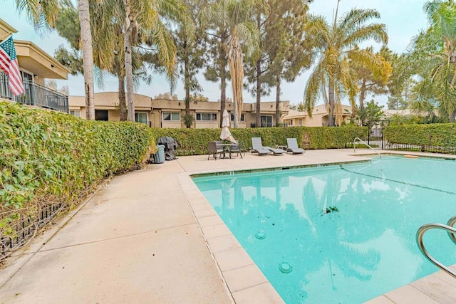 9860 Dale Ave Unit D10, Spring Valley, CA 91977 - view of swimming pool featuring a patio area and a residential view
