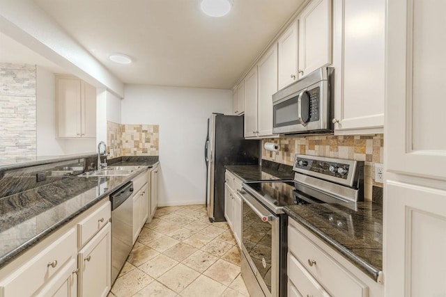 9860 Dale Ave Unit D10, Spring Valley, CA 91977 - kitchen featuring stainless steel appliances, backsplash, and dark stone countertops