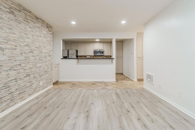 9860 Dale Ave Unit D10, Spring Valley, CA 91977 - unfurnished living room featuring light wood-type flooring and recessed lighting