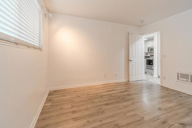 9860 Dale Ave Unit D10, Spring Valley, CA 91977 - unfurnished room with light wood-style floors and baseboards