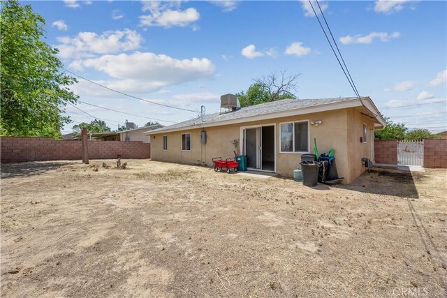 45324 Rodin Ave, Lancaster, CA 93535 - back of house with a fenced backyard and stucco siding