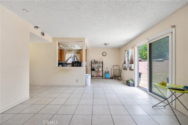 45324 Rodin Ave, Lancaster, CA 93535 - tiled spare room featuring a textured ceiling and visible vents