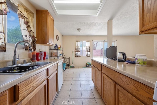 45324 Rodin Ave, Lancaster, CA 93535 - kitchen with light countertops, dishwasher, and a sink