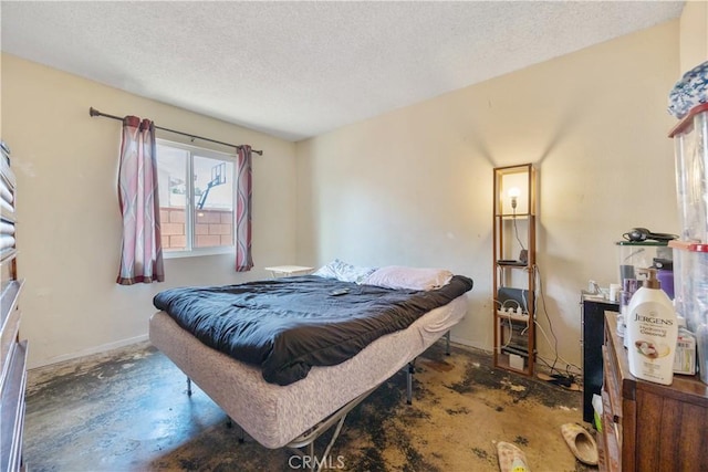 45324 Rodin Ave, Lancaster, CA 93535 - bedroom featuring a textured ceiling, baseboards, and concrete floors