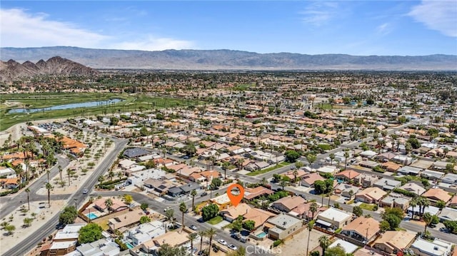 birds eye view of property with a residential view and a water and mountain view