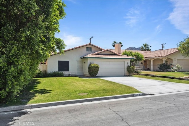 ranch-style house with an attached garage, a tiled roof, stucco siding, a chimney, and driveway
