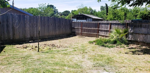 view of yard with a fenced backyard