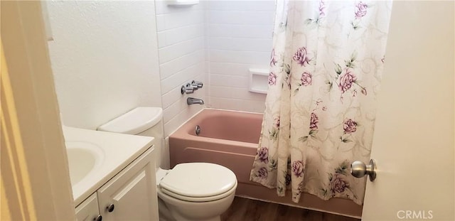full bath featuring toilet, shower / tub combo, wood finished floors, and vanity