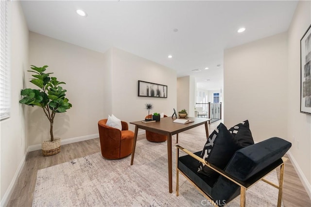 office space with wood finished floors, baseboards, and recessed lighting