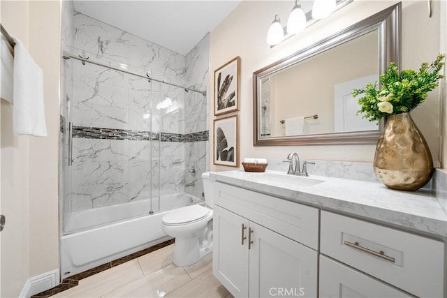 bathroom with toilet, shower / bathing tub combination, and vanity