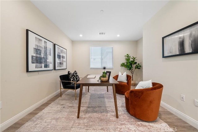 office area featuring recessed lighting, baseboards, visible vents, and wood finished floors
