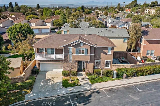 2852 N Santa Fe Pl, Orange, CA 92865 - view of front of property featuring concrete driveway, stucco siding, a residential view, and an attached garage