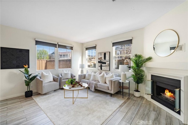 2852 N Santa Fe Pl, Orange, CA 92865 - living room with a glass covered fireplace, plenty of natural light, and wood finished floors