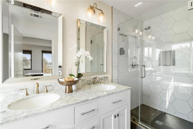 2852 N Santa Fe Pl, Orange, CA 92865 - bathroom with double vanity, visible vents, a marble finish shower, and a sink