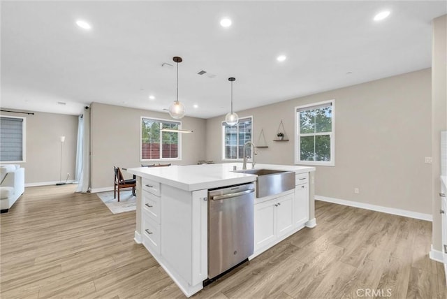 26 Wagon Wheel St, Phillips Ranch, CA 91766 - kitchen featuring stainless steel dishwasher, a sink, light wood finished floors, white cabinetry, and recessed lighting