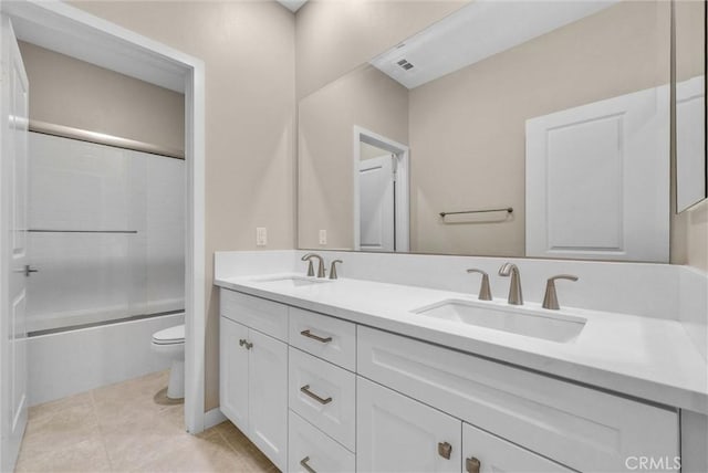 26 Wagon Wheel St, Phillips Ranch, CA 91766 - full bathroom with toilet, double vanity, shower / bath combination with glass door, and tile patterned floors
