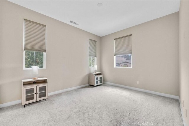 26 Wagon Wheel St, Phillips Ranch, CA 91766 - unfurnished room with healthy amount of natural light, baseboards, and carpet flooring
